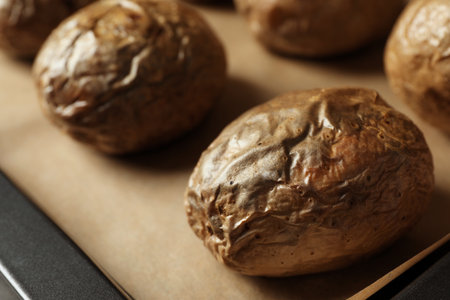 Tray with baked jacket potatoes, closeup viewの写真素材