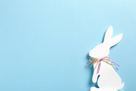 Easter bunny figure on color background, top view. Space for textの写真素材