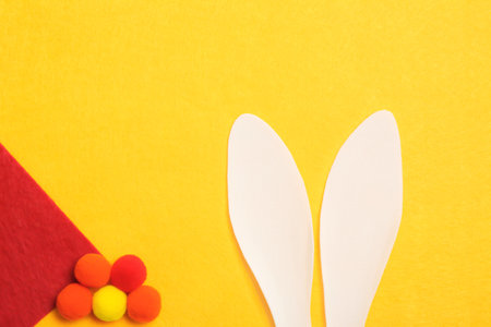 Flat lay composition of funny Easter bunny ears on color background, space for textの写真素材