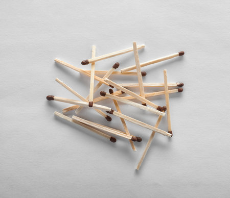 Pile of wooden matches on white background, top viewの写真素材