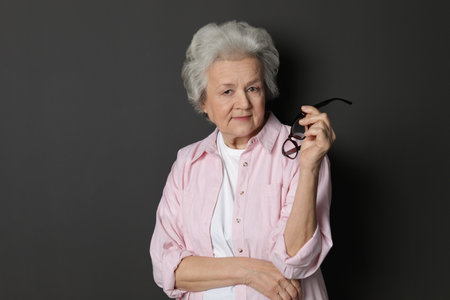 Portrait of mature woman on black backgroundの写真素材