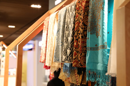 DUBAI, UNITED ARAB EMIRATES - NOVEMBER 04, 2018: Different scarves on rack in storeの写真素材