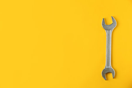 New wrench on color background, top view with space for text. Plumber toolsの写真素材