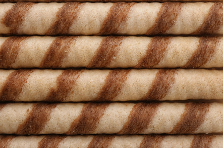 Tasty wafer roll sticks as background, top view. Crispy foodの写真素材