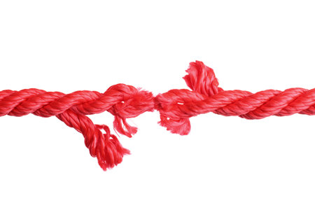 Rupture of red climbing rope on white backgroundの写真素材
