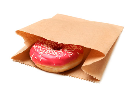 Paper bag with donut on white background. space for designの写真素材