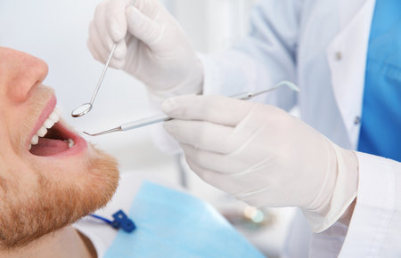 Dentist examining patient's teeth in modern clinic, closeupの写真素材