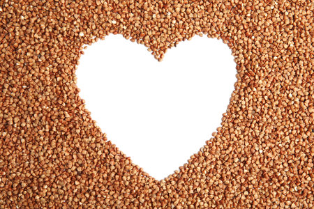 Frame made of uncooked buckwheat on white background, top viewの写真素材
