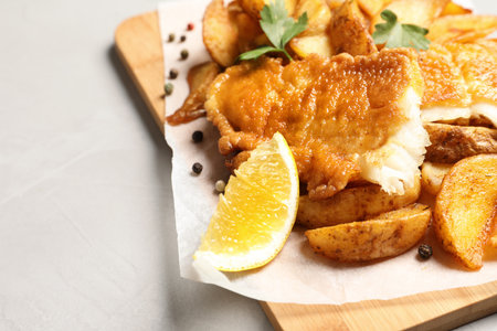 British traditional fish and potato chips on table, closeup with space for textの写真素材