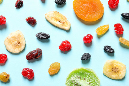 Flat lay composition with different dried fruits on color background. healthy lifestyleの写真素材