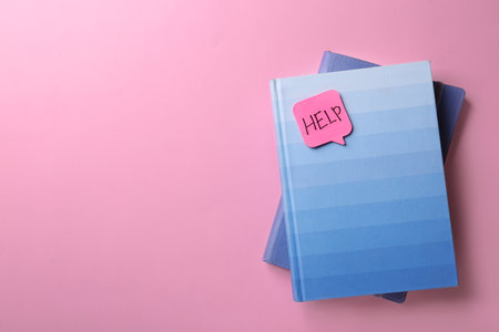 Notebooks and sticker with word HELP on color background, top view. Space for textの写真素材