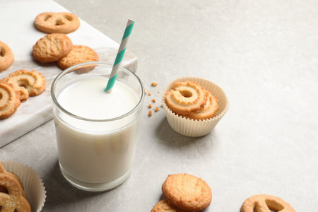 Danish butter cookies and glass of milk on gray table. Space for textの写真素材