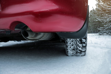 Car on snowy road, closeup. winter seasonの写真素材