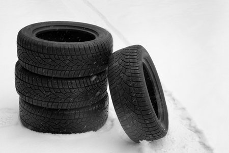 New winter tires on fresh snow outdoorsの写真素材