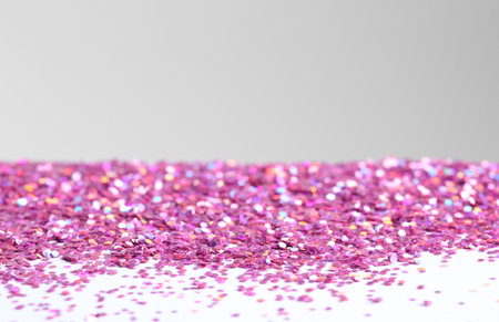 Beautiful shiny paillettes on light background. Space for textの写真素材
