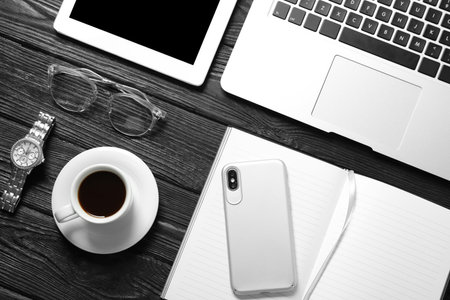Flat lay composition with laptop and notebook on wooden table. Blogger's workplaceの写真素材