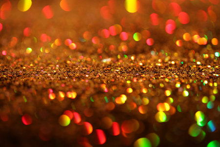 Shiny golden glitter as background, closeup viewの写真素材