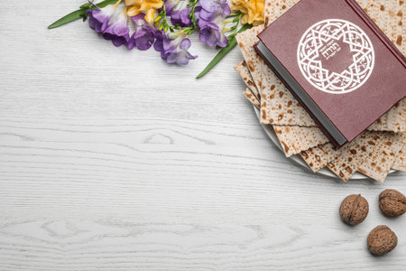 Flat lay composition with matzo and Torah on wooden background, space for text. Passover (Pesach)の写真素材