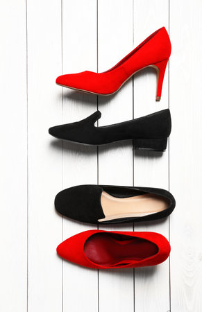 Flat lay composition with stylish shoes on wooden backgroundの写真素材