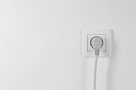 Power socket and plug on white background. Electrician's equipmentの写真素材