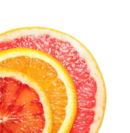 Slices of fresh citrus fruits on white background, top viewの写真素材