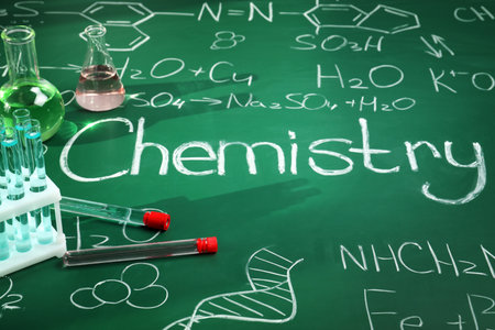 Composition with laboratory glassware on chalkboard. Chemistry conceptの写真素材