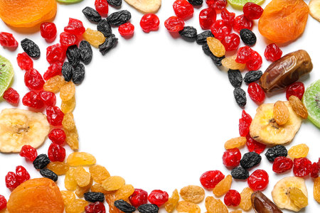 Frame made of different dried fruits on white background, top view with space for text. healthy lifestyleの写真素材