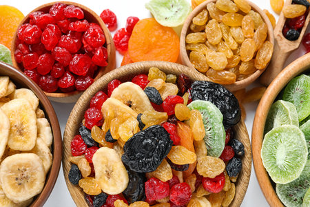 Bowls with different dried fruits on white background, flat lay. healthy lifestyleの写真素材
