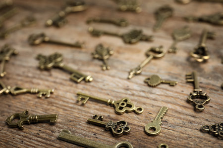 Old vintage keys on wooden background, closeupの写真素材