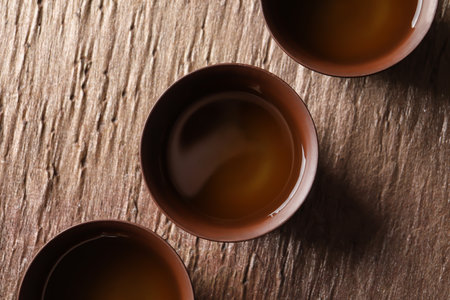 Cups of Tie Guan Yin oolong tea on table, top viewの写真素材