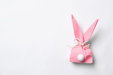 Creative Easter bunny gift bag on white background, top viewの写真素材