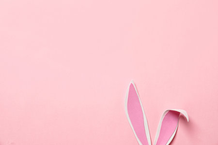 Funny Easter bunny ears on color background, top view with space for textの写真素材