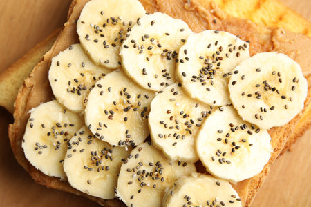 Tasty toast with banana, peanut butter and chia seeds, closeupの写真素材