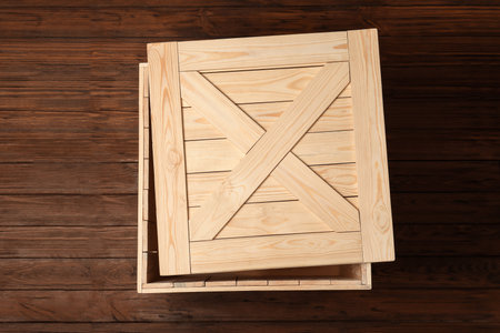 Wooden crate with lid on color background, top viewの写真素材