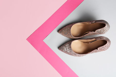 Stylish high heel shoes on color background, top view. Space for textの写真素材
