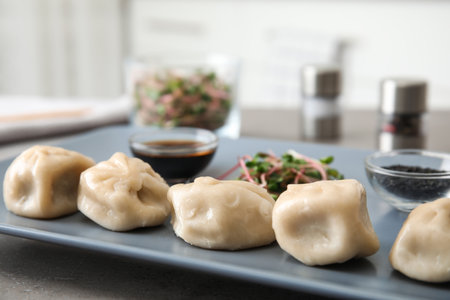 Plate with tasty baozi dumplings on table, closeupの写真素材