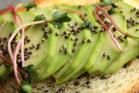 Tasty toast with avocado, sprouts and chia seeds, closeupの写真素材