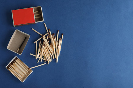 Flat lay composition with matches and space for text on color backgroundの写真素材