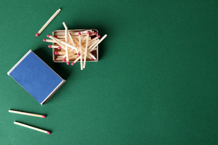 Flat lay composition with matches and space for text on color backgroundの写真素材