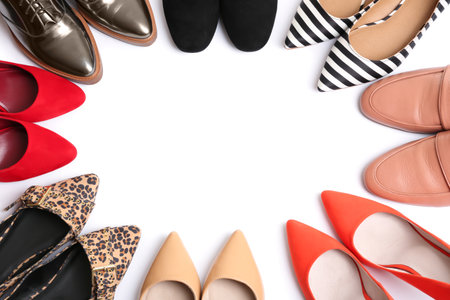 Frame made of different shoes on white background, top view with space for textの写真素材