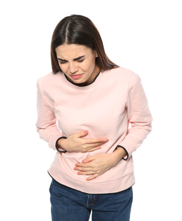 Young woman suffering from digestive disorder isolated on whiteの写真素材