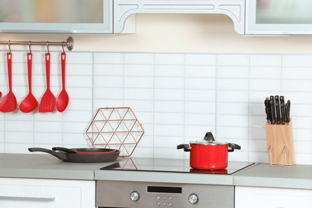 Clean cookware and utensils in modern kitchenの写真素材