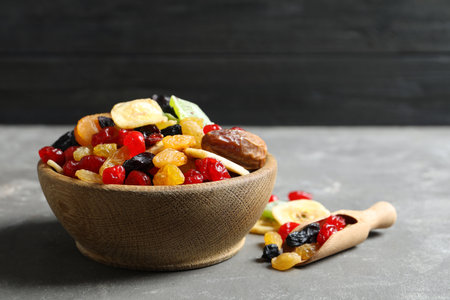 Bowl and scoop with different dried fruits on table, space for text. healthy lifestyleの写真素材