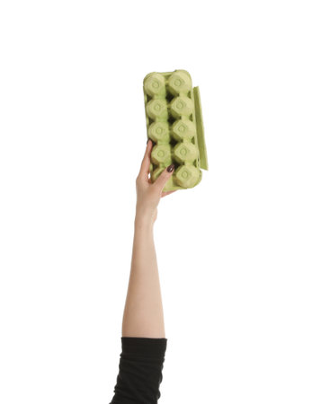 Woman holding egg carton isolated on white, closeup. Waste recycling concept
