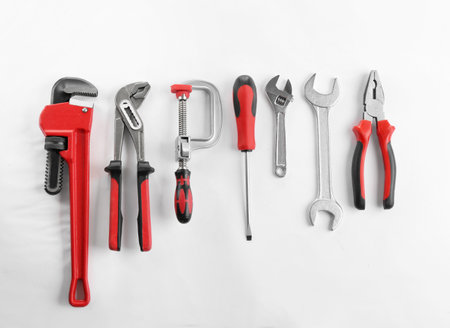 Flat lay composition with construction tools on white backgroundの写真素材
