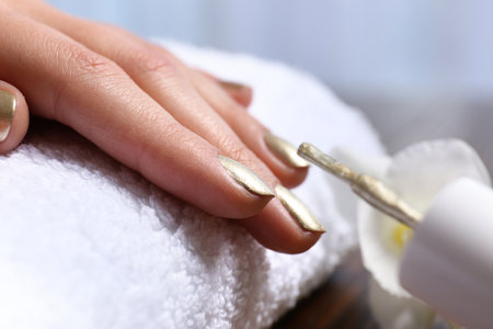 Woman getting manicure in salon, closeup. Nail polish trendsの写真素材