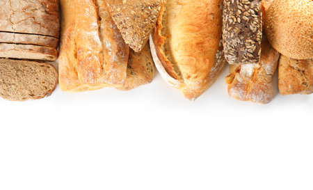 Different kinds of bread on white background, top viewの写真素材