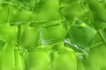 Green jelly cubes as background, closeup viewの写真素材