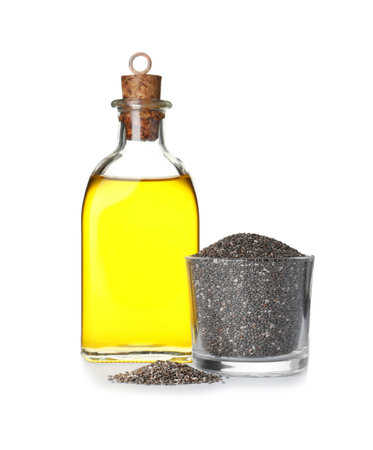 Bottle of chia oil and glass with seeds on white backgroundの写真素材