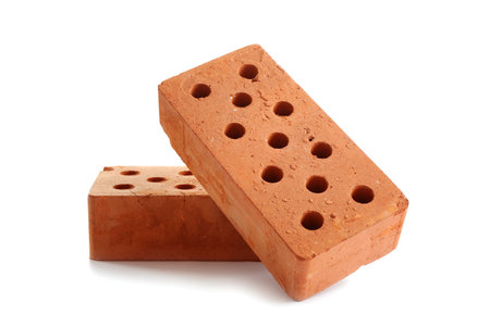 New cored bricks on white background. construction industryの写真素材